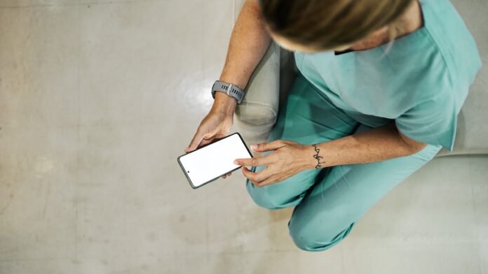 nurse-scrolling-on-phone.jpg