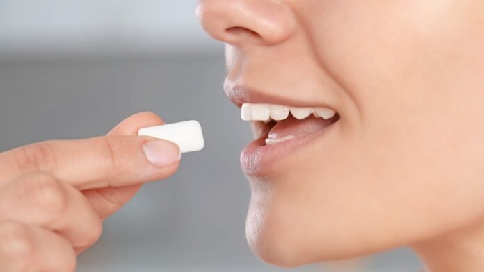 woman-putting-gum-in-mouth.jpg