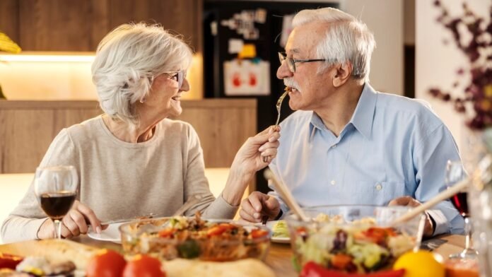 senior-woman-feeding-husband.jpg